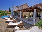 Luxury villa by the sea - pool terrace with loungers